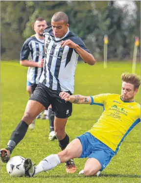  ?? Picture: Alan Langley FM4704999 ?? Spartans’ progress halted by a sliding tackle from Rising Sun