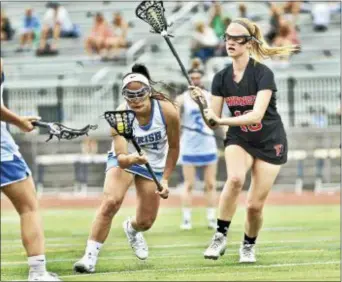  ?? KYLE FRANKO — TRENTONIAN PHOTO ?? Notre Dame’s Gabby Skowronski (17) gets past Pennington’s Emma Garry (18) on her way to goal during a MCT quarterfin­al game on Saturday.