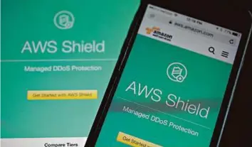  ?? Bloomberg ?? The Amazon Web Services (AWS) Shield website. In the last year, the company has pulled in profit of $2.4 billion overall, but AWS alone made a profit of $3.1 billion.