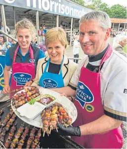  ??  ?? First Minister Nicola Sturgeon with young sheep industry ambassador Zoey Symington and butcher Charles Raeburn.