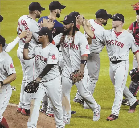  ?? AP PHOTO ?? ROLLING ALONG: The Red Sox celebrate after beating the Marlins last night in Miami.
