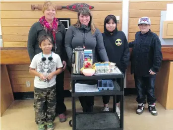  ??  ?? Krista Benjamin, left, and Stephanie Pelletier run the breakfast, snack and lunch program at Ecole North Oyster Elementary near Ladysmith. The school has asked the Vancouver Sun Adopt-A-School fund for help.