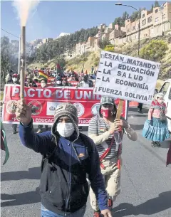  ?? AFP ?? Workers march from El Alto to the main streets of La Paz to protest the policies of the government of President Jeanine Anez on Tuesday.