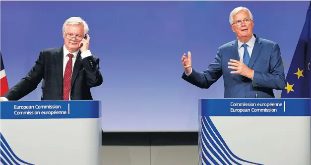  ??  ?? Worlds apart... David Davis scratches his head as EU negotiator Michel Barnier addresses a press conference yesterday after talks broke up unexpected­ly early