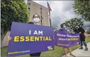  ?? Allen J. Schaben Los Angeles Times ?? HOSPITAL workers protest in Garden Grove in May. Unions support the plan to adopt stricter safety rules.