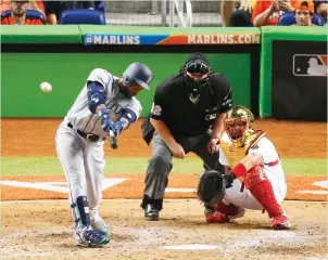  ?? (TNS) ?? AMERICAN LEAGUE second baseman Robinson Cano of the Seattle Mariners hits the game-winning solo home run in the 10th inning of the AL’s 2-1 victory over the National League in Tuesday night’s MLB All-Star Game at Marlins Park in Miami, the first game...