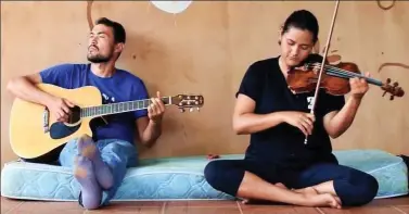  ??  ?? Creative space: Two residents playing music at the remote resort in south Brazil