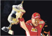  ?? MARK THOMPSON GETTY IMAGES FILE PHOTO ?? Driver Sebastian Vettel celebrates on the podium after winning the Bahrain Formula One Grand Prix on April 8, 2018.