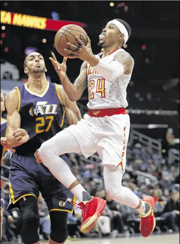  ?? JOHN BAZEMORE / ASSOCIATED PRESS ?? Hawks forward Kent Bazemore had scored in double digits 11 times in 15 games entering Friday night’s game at Sacramento.