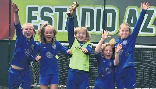  ??  ?? Macc Town Ladies Under-9 Sylks celebrate winning the Manchester FA Girls World Cup. Pictured (left to right): Layla Woollam, Abigail Poulton, Chloe Slater, Amber Newbery, Tia Hiscock