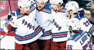  ?? AP ?? WE GOT THIS! Alexis Lafreniere and Kaapo Kakko celebrate Filip Chytil’s opening goal in the Rangers’ 2-1 overtime loss in Game 1.