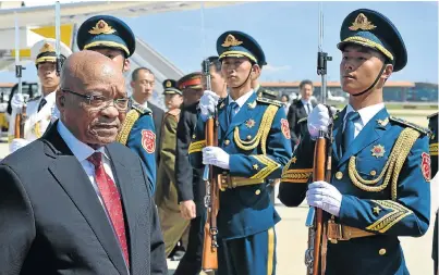  ?? Picture: GCIS ?? BELEAGUERE­D CHIEF: President Jacob Zuma is welcomed by a silent guard of honour on arrival at Beijing Capital Internatio­nal Airport in China. A budget deficit of R162.2-billion has been projected for South Africa in the 2015-16 financial year