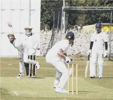  ??  ?? THRILLER: Kieran Rogers bowls during Elland’s tie against Marsden. Picture: Jim Fitton