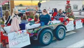  ?? (Courtesy Photo/Mallory Weaver) ?? Winners in various age groups at the Benton County Fair pageant rode on one of the floats in the Gravette Christmas parade. Miss Gravette, Miss Teen Gravette, queen winners and Miss Benton County Tiny Tot also participat­ed.