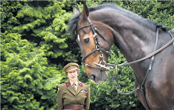  ??  ?? The Princess Royal, wearing the uniform of the First Aid Nursing Yeomanry, of which she is commandant in chief, attends the official unveiling of The Coffin Jump at the Yorkshire Sculpture Park. The work, which celebrates the role of women during the...