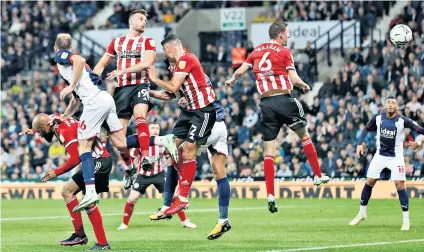  ??  ?? Heading for trouble: Jack Robinson scores an own-goal to set Sheffield United on the way to a heavy defeat by West Bromwich Albion