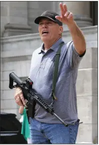  ?? (Arkansas Democrat-Gazette/Thomas Metthe) ?? Robert “Bigo” Barnett talks to the crowd during a rally Sept. 3 at the state Capitol after an announceme­nt by Rep. Dan Sullivan, R-Jonesboro, of a lawsuit aimed at overturnin­g Gov. Asa Hutchinson’s state of emergency as well as his administra­tion’s public health directives relating to the pandemic.