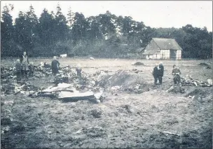  ??  ?? n CRASH SITE: Flight engineer Ronald Barton, 34, and his seven comrades were flying their final mission over Germany in 1944 when they crashed while heading for home