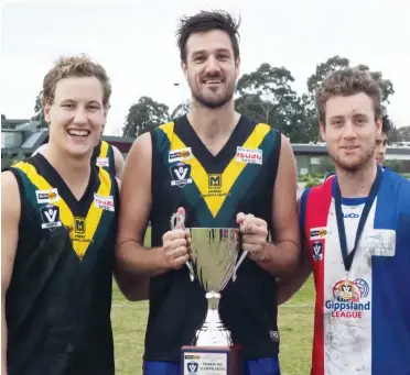  ??  ?? Drouin members of the Gippsland team at Moe, from left Tom Barr, Bob McCallum and Eddie Morris, enjoyed getting their hands on the Community Championsh­ip Cup the side won in convincing style against Murray League.