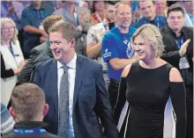  ?? ANDREW VAUGHAN THE CANADIAN PRESS ?? Tory Leader Andrew Scheer and his wife, Jill, head through the crowd as he prepares to address the party's national policy convention in Halifax.