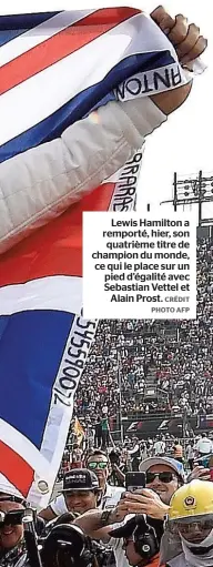  ??  ?? Lewis Hamilton a remporté, hier, son quatrième titre de champion du monde, ce qui le place sur un pied d’égalité avec Sebastian Vettel et Alain Prost.