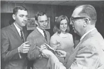  ?? JIM MCKNIGHT/THE COMMERCIAL APPEAL ?? William B. Street (Right), scholarshi­p chairman of the Memphis Press Club, presents checks to 3 of the 22 winners of awards and scholarshi­ps announced at the Gridiron Show at Holiday Hall on 29 May 1968. They are (From Left) Johnny Johnson of Natchez,...