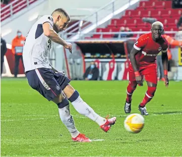  ??  ?? Rangers’ Borna Barisic fires home his first penalty of the night to make it 2-2.