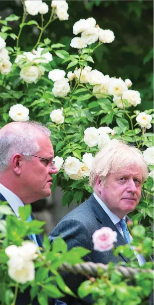  ?? REUTERS ?? El primer ministro australian­o, Scott Morrison, junto a su homólogo británico, Boris Johnson