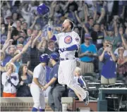  ?? AP ?? The Cubs’ David Bote celebrates after hitting the game-winning grand slam against the Nationals.