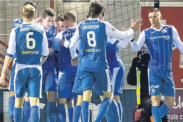  ?? Pictures: SNS. ?? St Johnstone players celebrate as Stefan Scougall (partially hidden) breaks his goalscorin­g duck for Tommy Wright’s men with the winning goal against Hamilton.