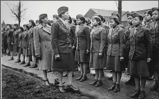  ?? (National Archives) ?? Somewhere in England, Maj. Charity E. Adams of Columbia, S.C., and Capt. Abbie N. Campbell, Tuskegee Institute, Tuskegee, Ala., inspect the first contingent of Black members of the Women’s Army Corps assigned to overseas service. The documentar­y “The Six Triple Eight,” focusing on the work of the 6888th Central Postal Directory Battalion during World War II, screens Tuesday at the MacArthur Museum of Arkansas Military History.