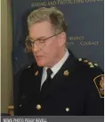  ?? NEWS PHOTO PEGGY REVELL ?? Medicine Hat Police Chief Andy McGrogan reads a statement at a press conference, where police announced that they believe it’s possible that the homicide which occurred on Mill Street is connected to a separate investigat­ion over the extortion of...