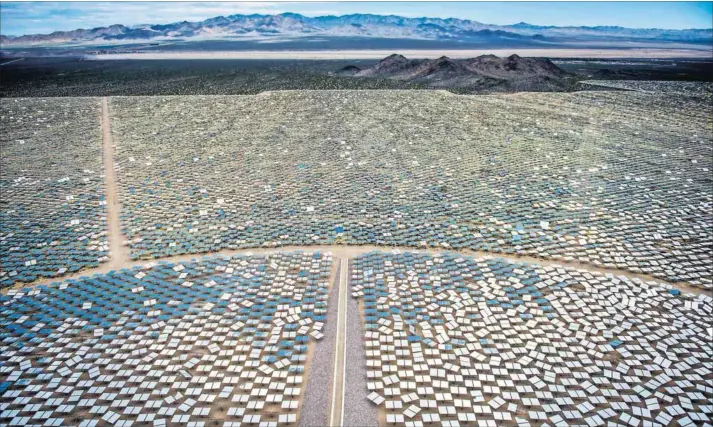  ?? Photo: Jacob Kepler/Bloomberg ?? Beaming: A solar ‘farm’ spreads across the Mojave Desert in the United States. Scientists are coming up with models that won’t take up so much space.