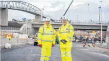  ??  ?? Success Keith Brown (left), the Cabinet Secretary for Economy, Jobs and Fair Work, with project manager Graeme Reid at the M74