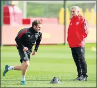  ??  ?? NO LET-UP: Juan Mata with Mourinho yesterday