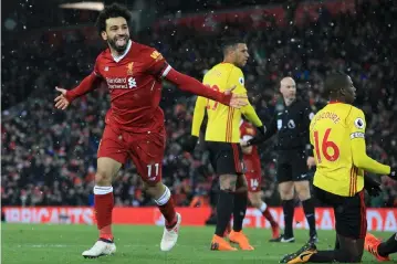  ??  ?? Mohamed Salah celebrates scoring the team’s fourth goal during the English Premier League football match between Liverpool and Watford at Anfield in Liverpool, north west England in this March 17 file photo. — AFP photo