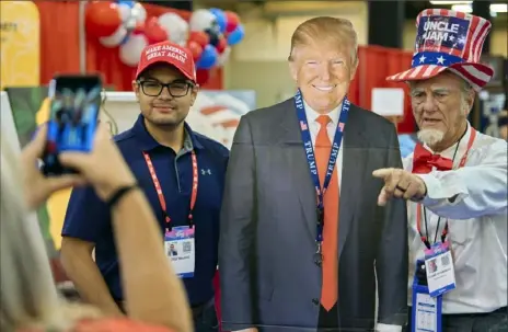  ?? Cooper Neill/The New York Times ?? A cardboard cutout of Donald Trump creates a photo opportunit­y at the Conservati­ve Political Action Conference in Dallas last month. The heavy use of Mr. Trump’s name has at times been a source of friction with the former president.