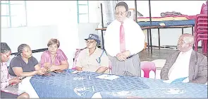  ?? (Pic: Sabelo Ndzinisa) ?? St Christophe­r’s High Head teacher Sabelo Hlophe informing Minister of Education Owen Nxumalo that Aphelele Dlamini, the best performing pupil in the last JC examinatio­ns, has since left the school.