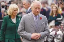  ?? JAMES GLOSSOP/POOL PHOTO VIA AP ?? Britain’s King Charles III and Camilla, queen consort, meet members of the public following a ceremony Nov. 9 at Micklegate Bar, in York, England.