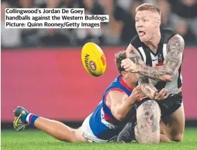  ?? ?? Collingwoo­d’s Jordan De Goey handballs against the Western Bulldogs. Picture: Quinn Rooney/Getty Images