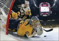  ?? BRUCE BENNETT — POOL PHOTO VIA AP ?? Nashville Predators goalie Pekka Rinne stops a shot by Pittsburgh Penguins center Jake Guentzel (59) during the second period of Game 4 of the Stanley Cup Final on Monday in Nashville, Tenn.