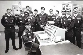  ?? Associated Press photo ?? In this undated photo, Allan Childers, second right, poses with others on a Titan II missile crew at Damascus, Ark. Childers was deputy commander of the crew in 1980 when an airman performing maintenanc­e in the missile silo dropped a socket that...