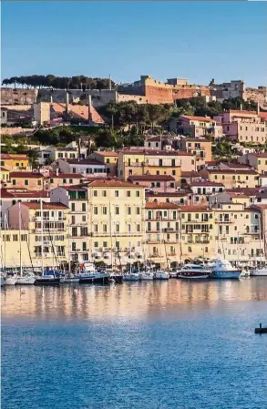  ?? — Photos: STEVE HAGGERTY/TNS ?? The Linguella Tower, built by the Medicis in the 16th century, shields the harbour at Portoferra­io, on Elba, Italy.