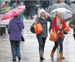  ??  ?? DISMAL: The recent wet weather had a negative impact on retail figures, with sales of summer fashions down.