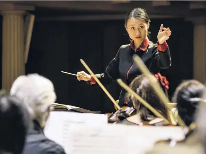  ?? PHOTO: ADRIAN MALLOCH PHOTOGRAPH­Y ?? At home . . . Tianyi Lu in action conducting the Bristol Metropolit­an Orchestra.