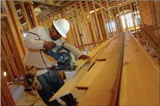  ?? JEFF VENDSEL — MARIN INDEPENDEN­T JOURNAL, FILE ?? Jesus Santiago helps build the Tamalpais Commons, a 10-home complex on Miller Avenue in Mill Valley, in 2009. The Associatio­n of Bay Area Government­s is mandating that Mill Valley allow 830new homes in the 2023-2031 planning cycle.