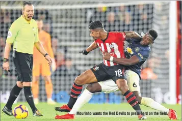  ??  ?? Manchester United's French midfielder Paul Pogba (R) tangles with Southampto­n's Gabonese midfielder Mario Lemina (C) during the English Premier League football match at St Mary's Stadium in Southampto­n, southern England. Mourinho wants the Red Devils to press hard on the field.