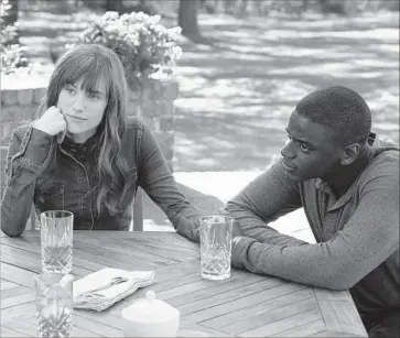  ?? Justin Lubin Universal Pictures ?? “GET OUT,” about a young black man (Daniel Kaluuya, right) whose trip to meet the parents of his white girlfriend (Allison Williams, left) turns deeply sinister, has received unanimous praise from film critics.