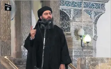  ?? AFP/Getty Images ?? BAGHDADI speaks in an image from video in July 2014. Reports of sightings and of his death are unconfirme­d.