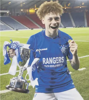  ??  ?? Winning goalscorer Nathan Young-coombes with the Scottish Youth Cup at Hampden.